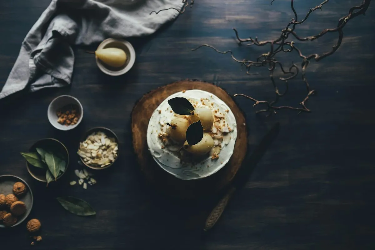 Chef-plated food on a dark dining surface
