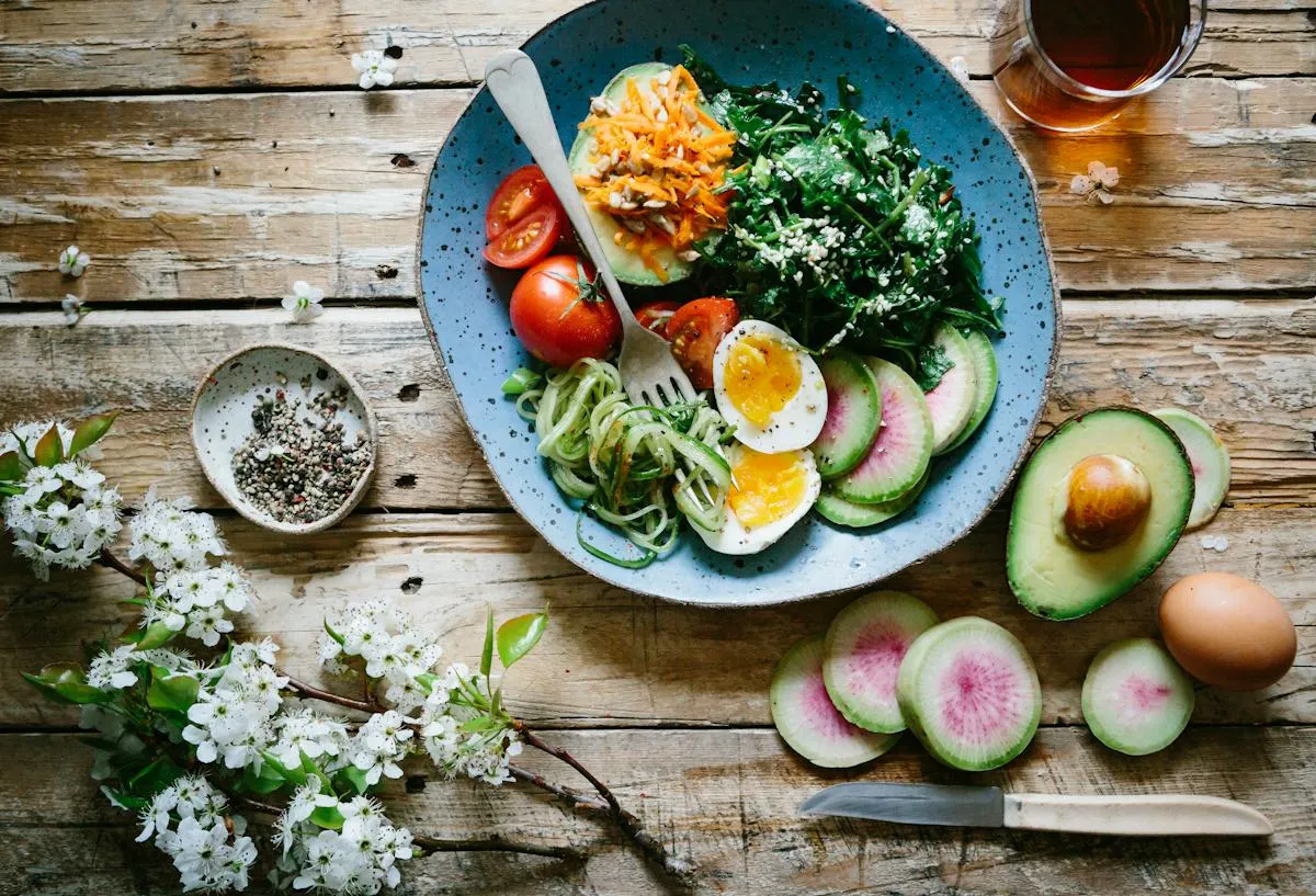 Fresh salad bowl on a rustic wooden table
