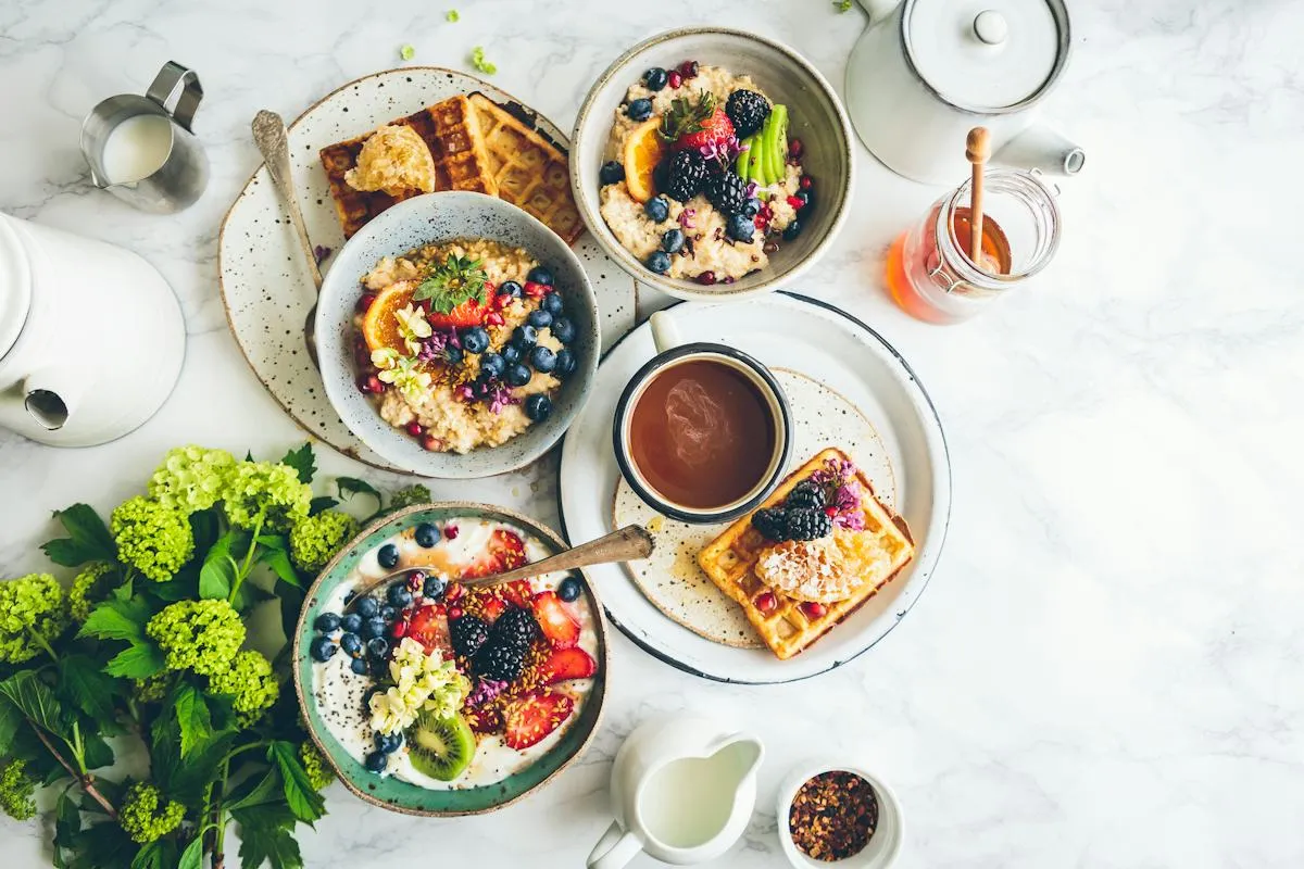 Colourful plated dishes arranged on a dining table