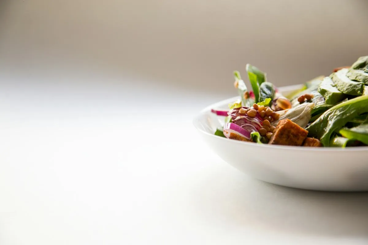 Fresh green salad plated for service