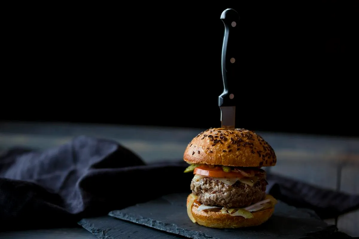 Gourmet burger on a dark restaurant background