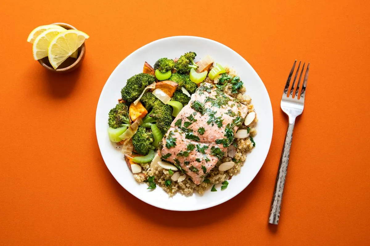 Herb-topped dish on an orange plate
