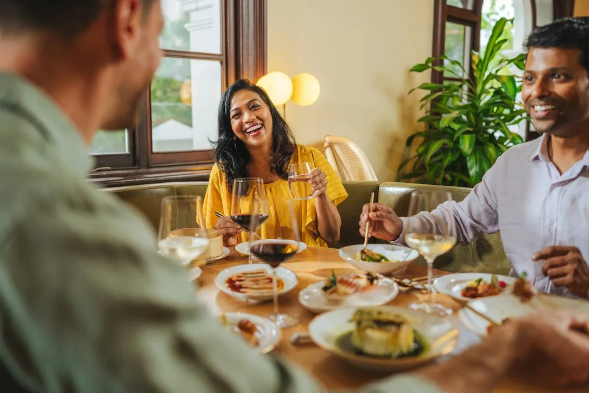 Guests enjoying conversation over dinner
