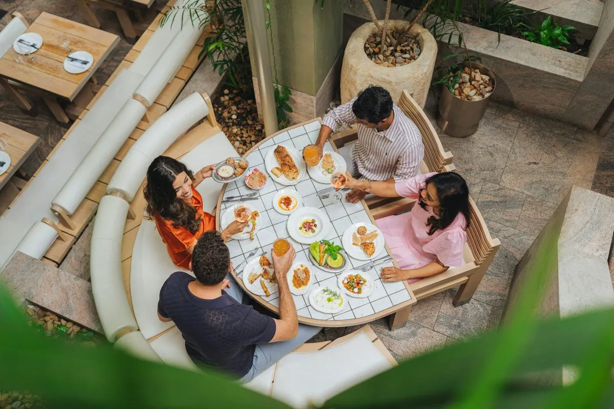 Friends enjoying dinner around a restaurant table